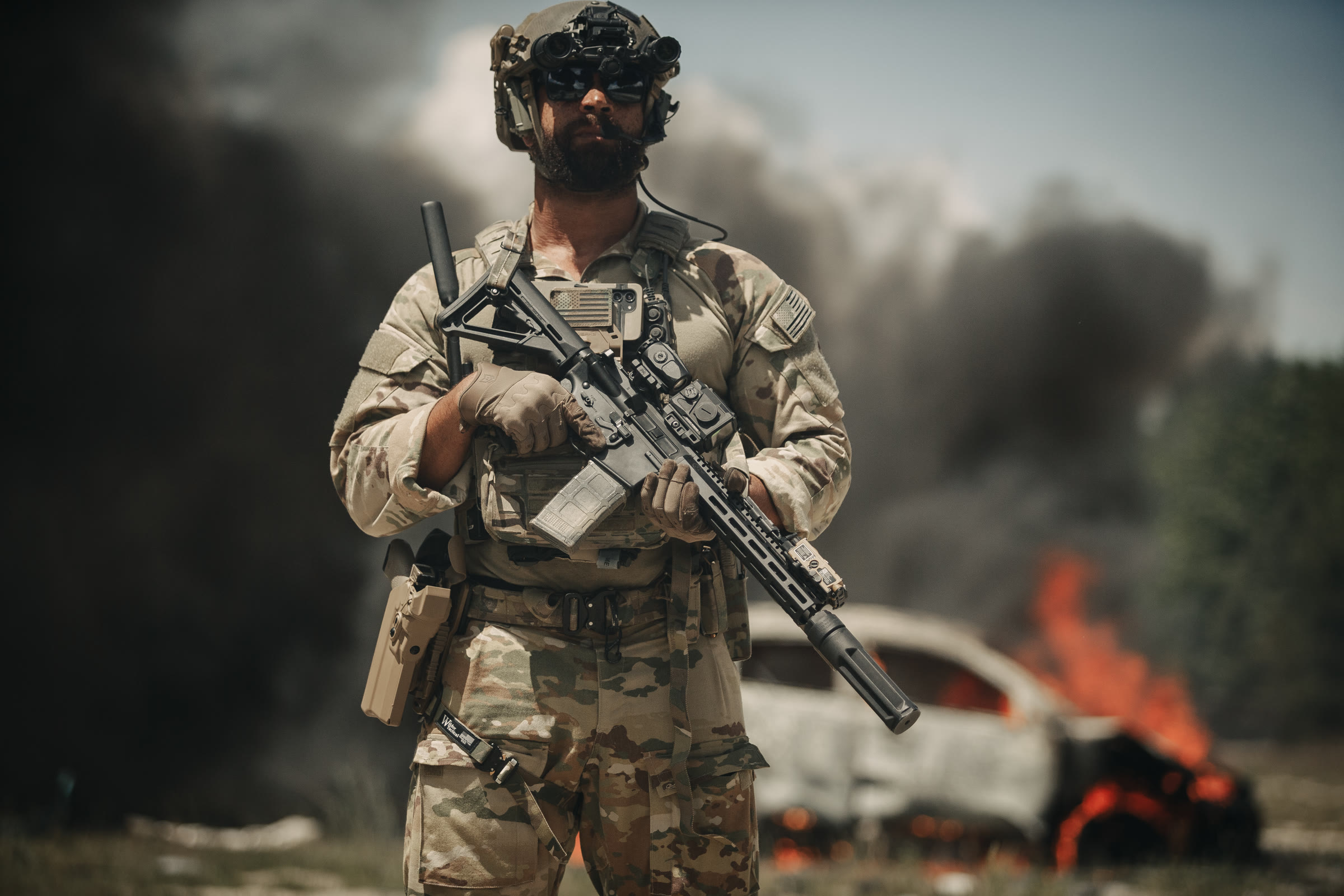 Suppressed carbine at the moment of fire, ejected brass mid-air
