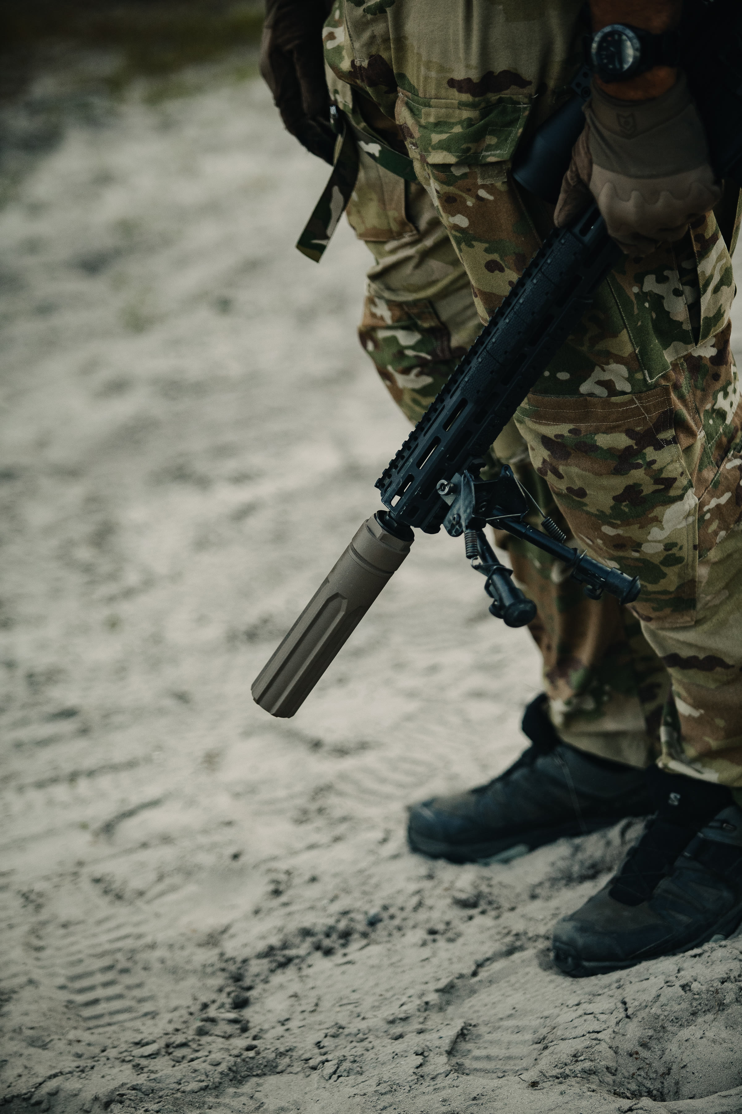 Operator firing suppressed rifle